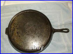 @12 Griswold, Erie, Pa, U. S. Cast Iron Skillet with 2 pour spouts and a fire ri