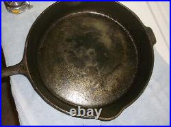 @12 Griswold, Erie, Pa, U. S. Cast Iron Skillet with 2 pour spouts and a fire ri