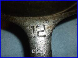 @12 Griswold, Erie, Pa, U. S. Cast Iron Skillet with 2 pour spouts and a fire ri