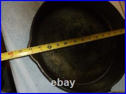 @12 Griswold, Erie, Pa, U. S. Cast Iron Skillet with 2 pour spouts and a fire ri