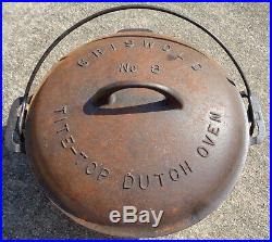 Cast iron Griswold No. 8 Tite Top Dutch oven (rusty bottom) & lid. No reserve