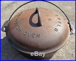 Cast iron Griswold No. 8 Tite Top Dutch oven (rusty bottom) & lid. No reserve