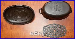 GRISWOLD CAST IRON # 5 OVAL ROASTER WITH LID AND TRIVET