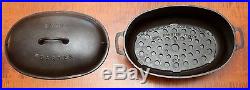 GRISWOLD CAST IRON # 5 OVAL ROASTER WITH LID AND TRIVET
